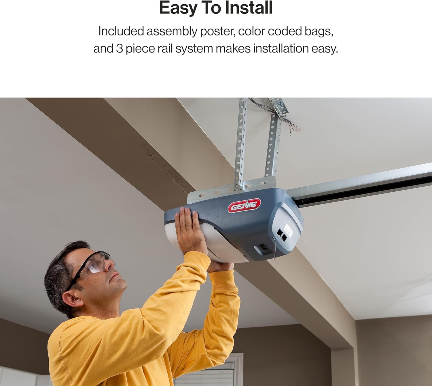 Man installing Genie SilentMax 1000 garage door opener
