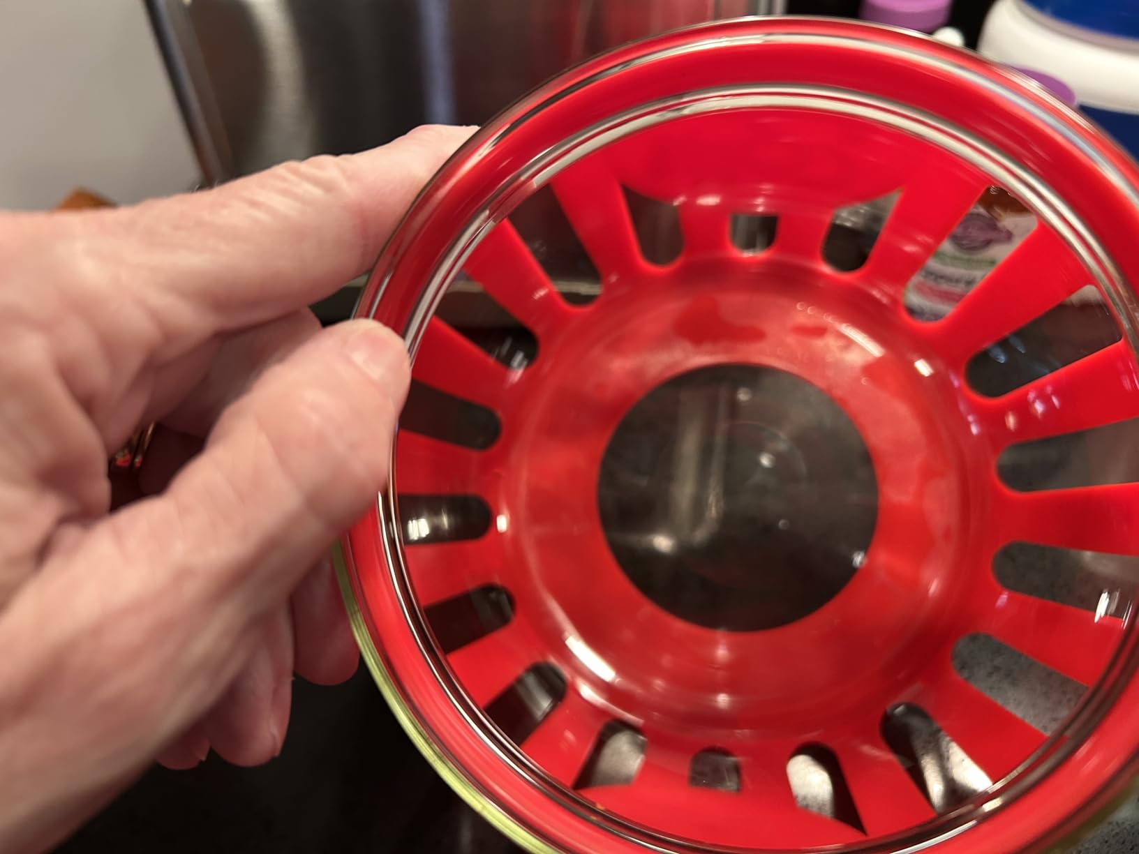 Water between the glass and red exterior.