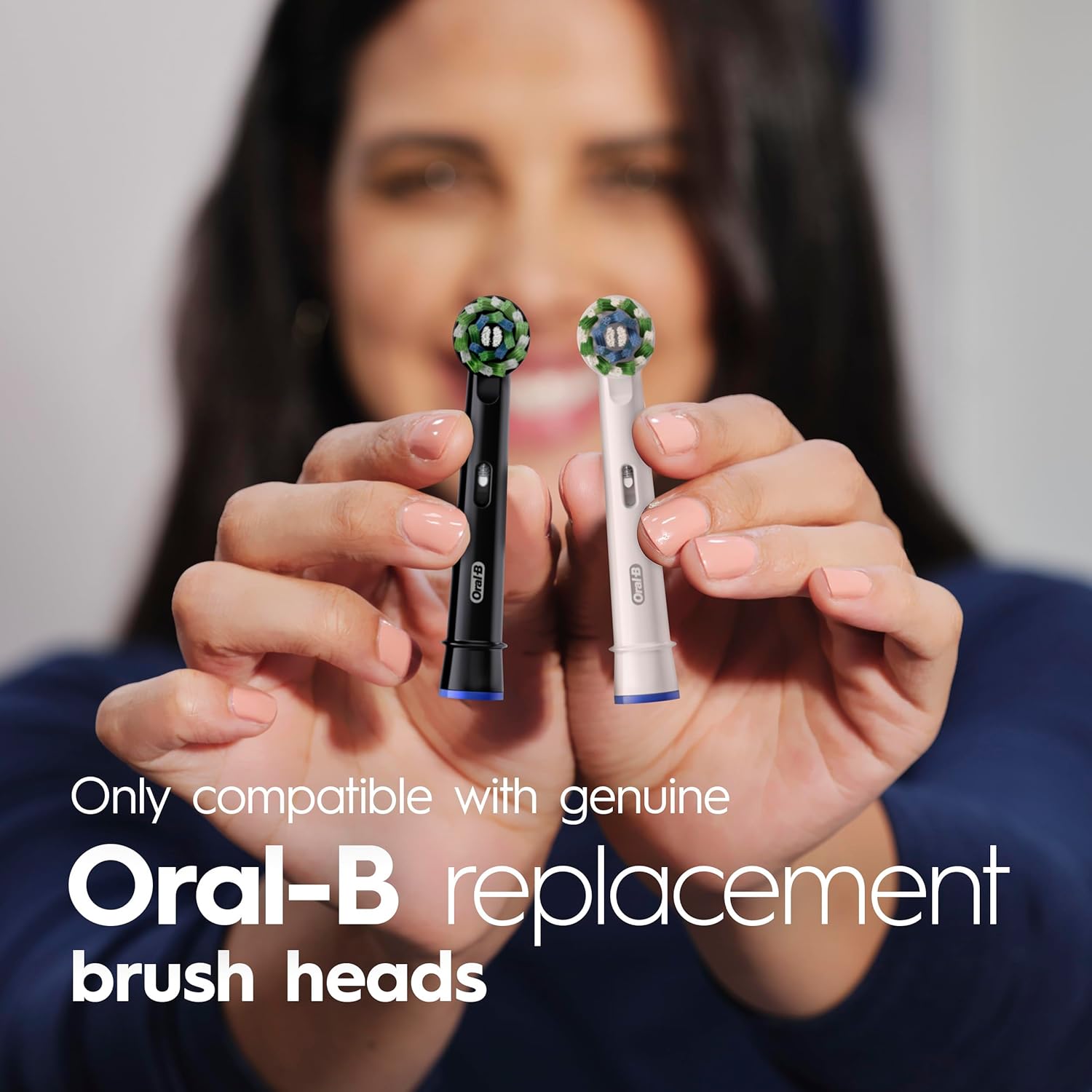 Image showing a worn brush head next to a new Oral-B brush head, indicating replacement every 3 months.
