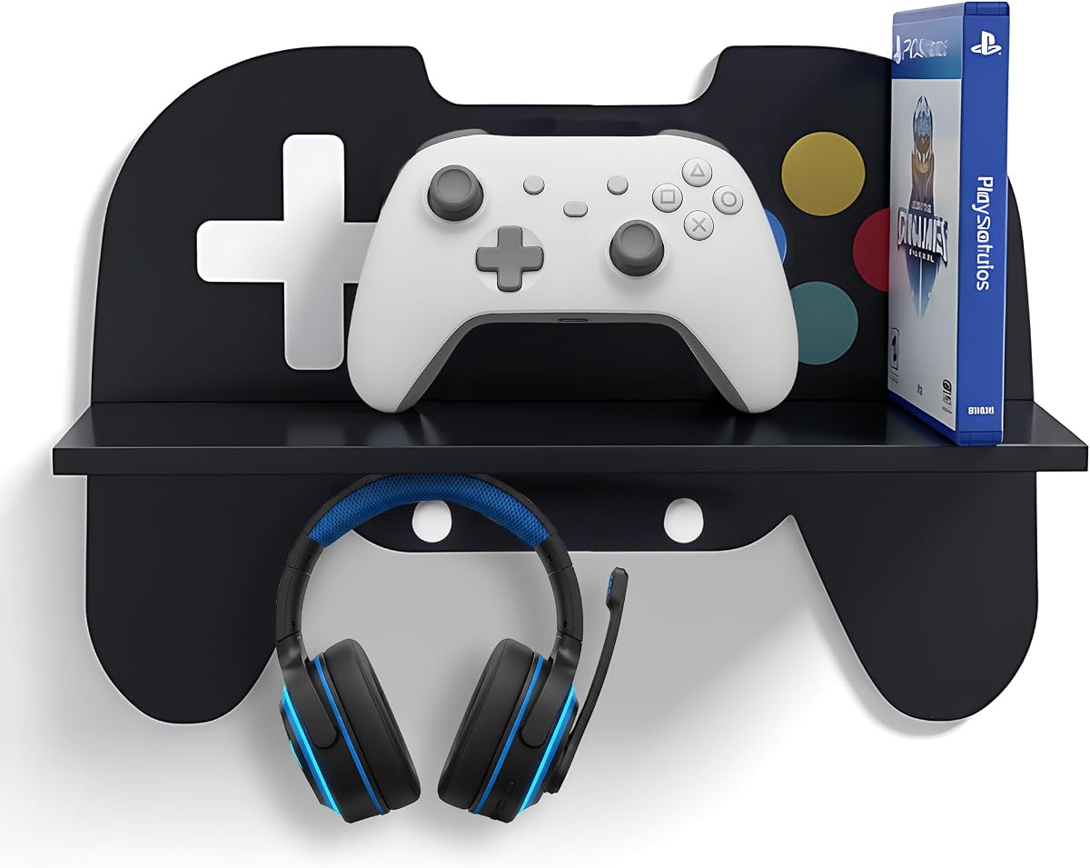 Game Room Decor, Black Gaming Floating Shelf, Game Controller Wall Shelf | Controller-shaped shelf with hooks for a headset and cables displays gamepads and collectibles as gaming room decor for boys