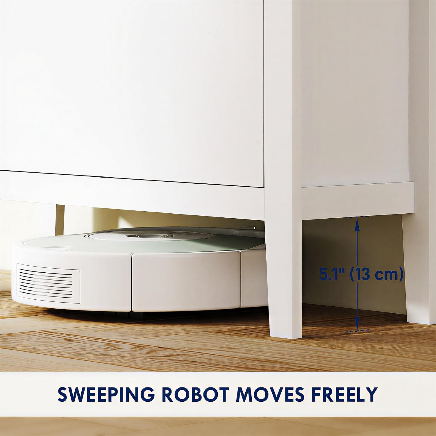 The HOMCOM shoe cabinet with a robot vacuum cleaner easily passing underneath, demonstrating the 5.1 inch (13 cm) clearance.