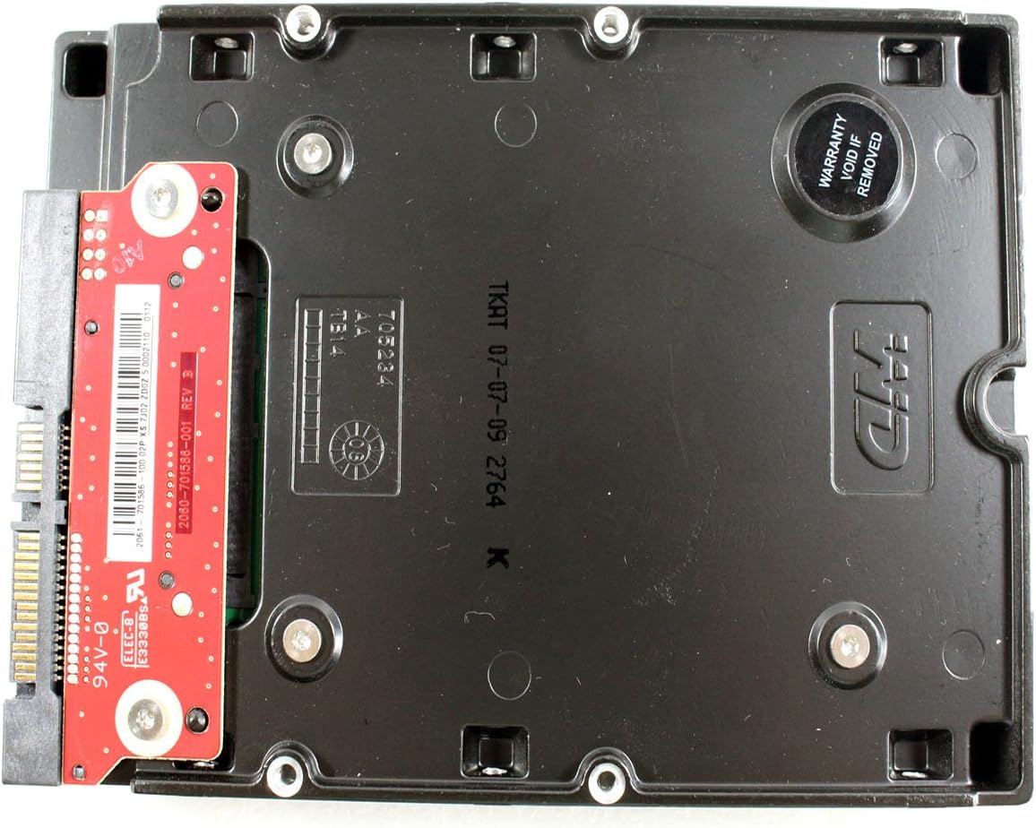 Bottom view of the Western Digital WD1600HLFS hard drive without its mounting tray, showing the exposed PCB and a 'Warranty Void If Removed' sticker.