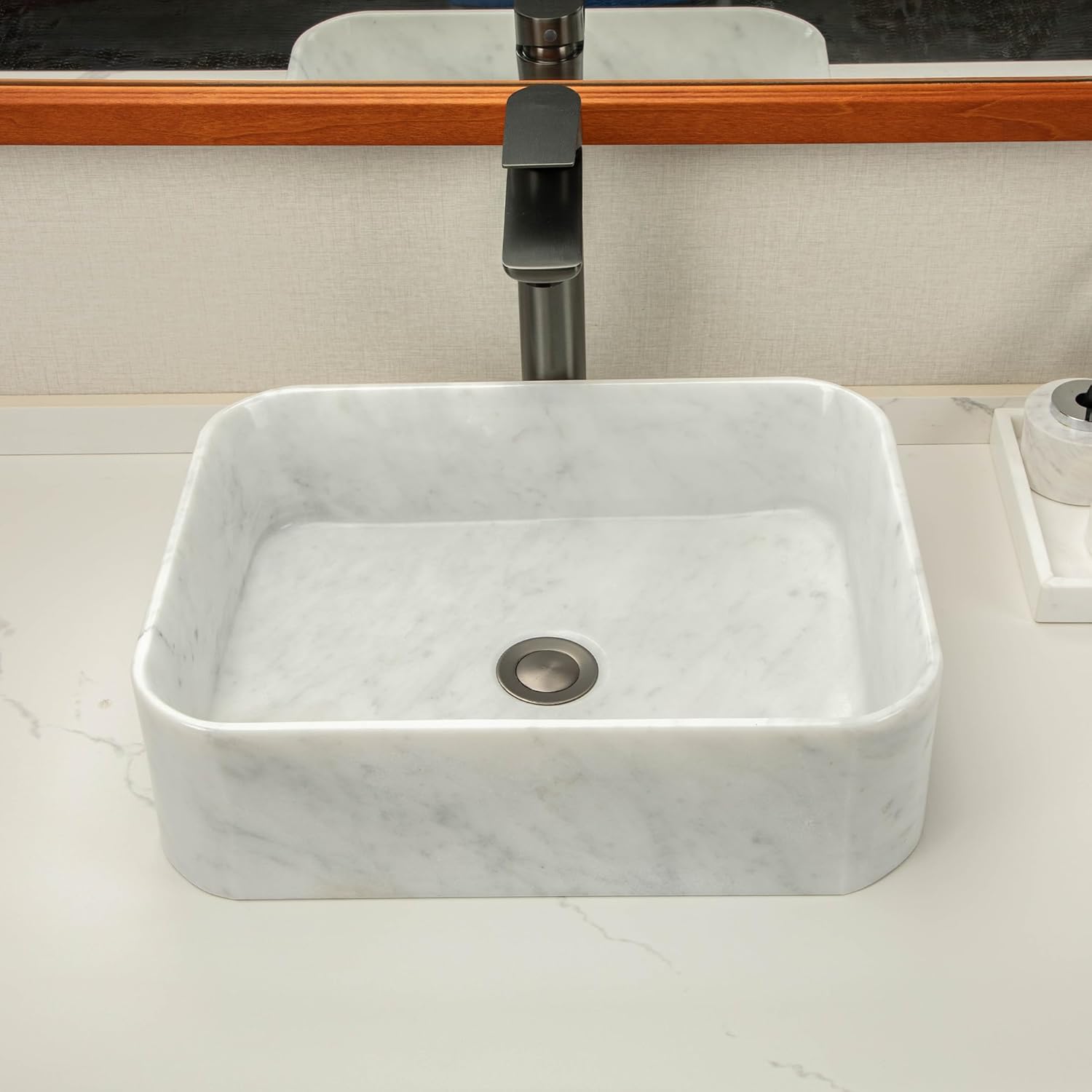 White square stone sinks made of natural Carrara white marble with irregular gray veining create an elegant and sophisticated bathroom vanity or countertop.