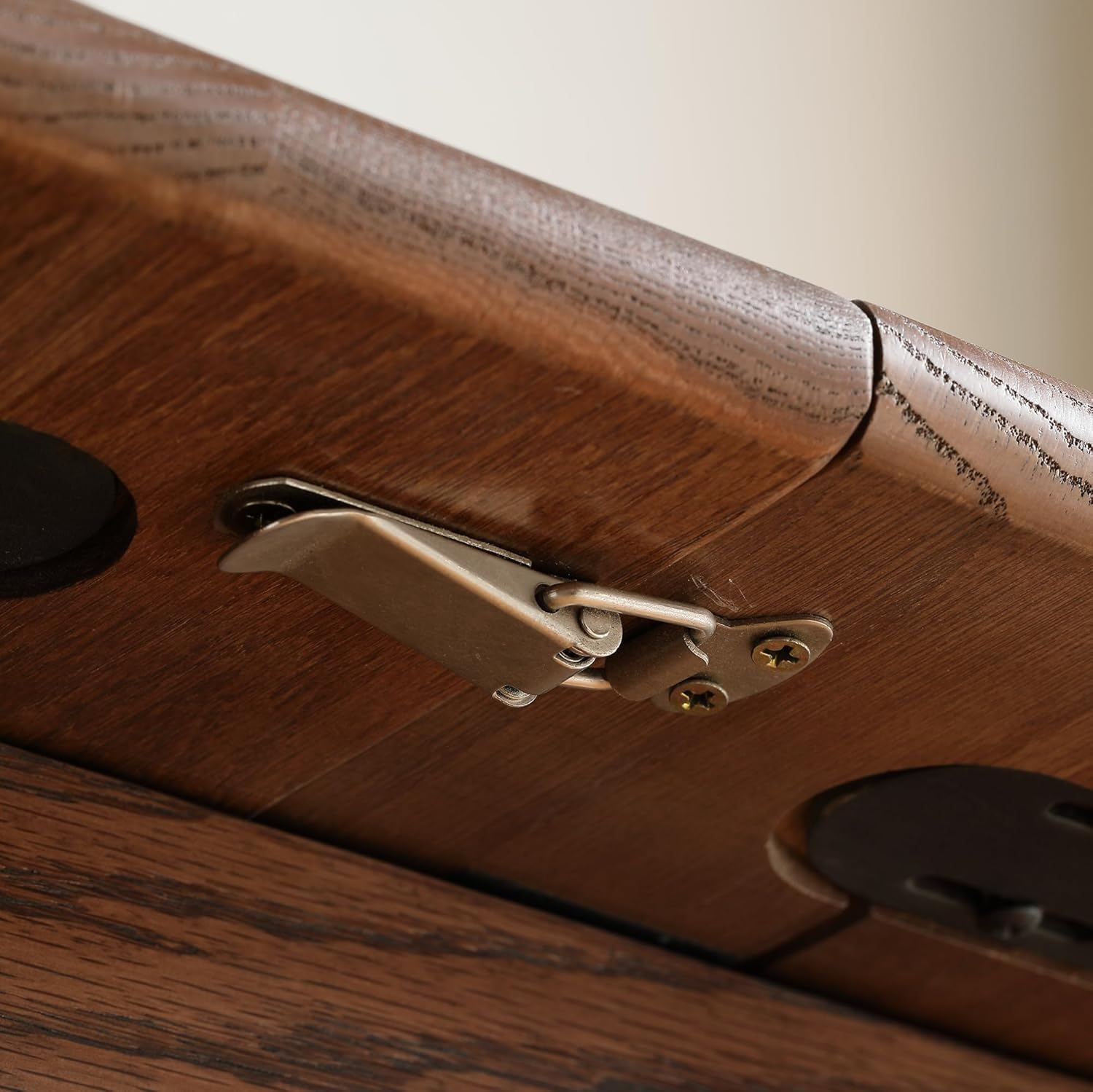 Close-up of a metal latch mechanism used to secure the table sections.