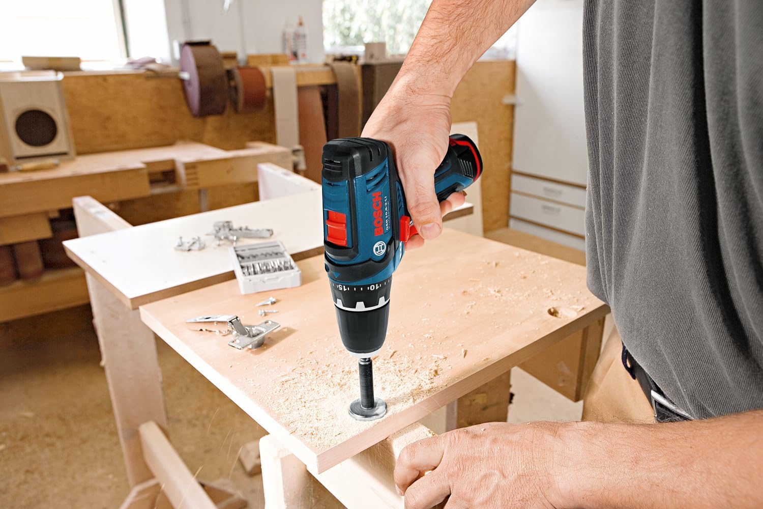 Bosch Professional GSR 12-2-LI drill being used to drill into a metal beam