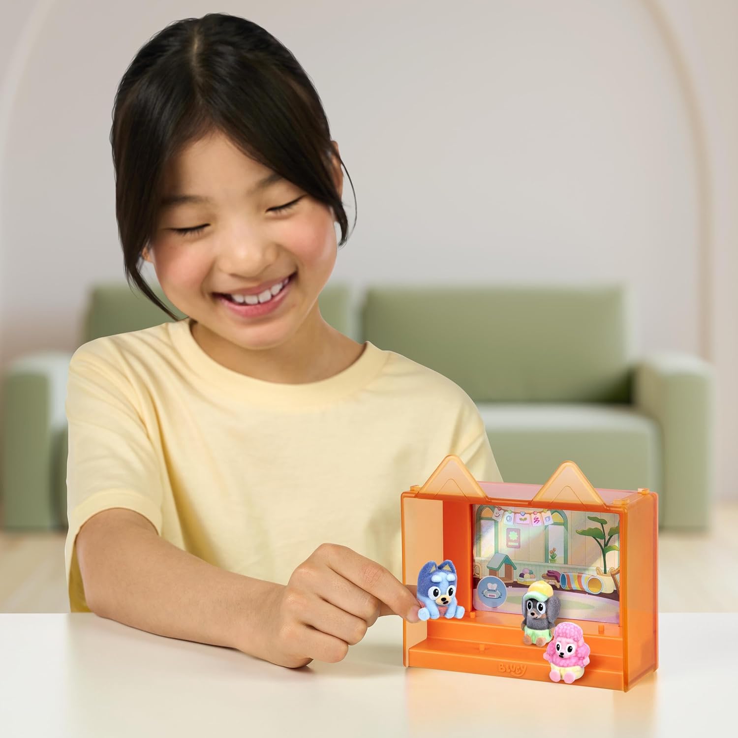 Bluey Fuzzies Episode Pack: Baby Race. with 3 Specially Flocked Collectible Mini-Figures (Incl. 1 Exclusive), Display Case, Foil Trading Card, and Collector's Guide. 50 Mini-Figures to Collect!