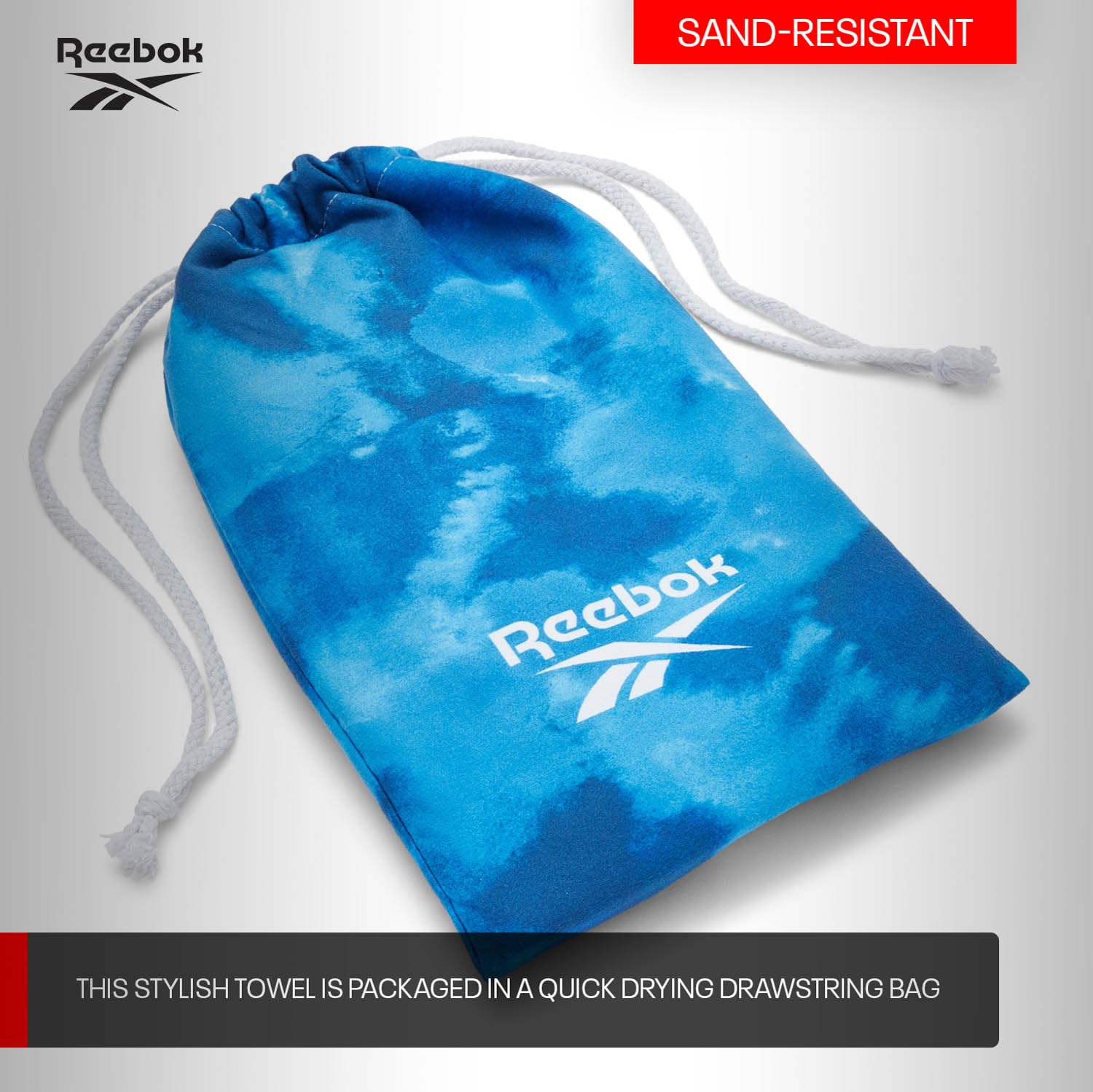 Reebok Toalla de Playa Microfibra Antiarena 90x180 cm | Secado Rápido, Ligera y Compacta con Bolsa | Toalla Grande para Gym, Piscina y Viaje, Diseño Azul Marino Nube