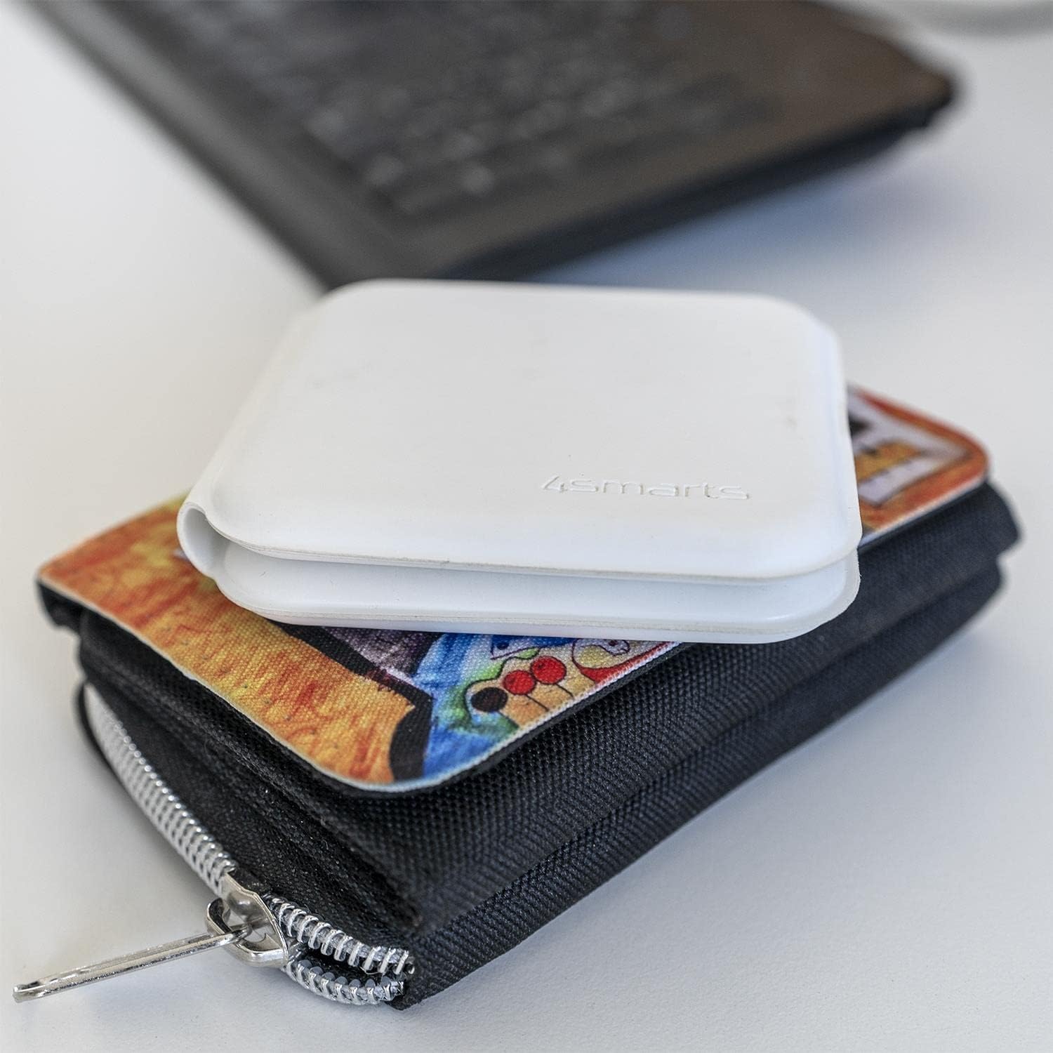Folded 4smarts Dual Foldable Wireless Charger placed on a wallet