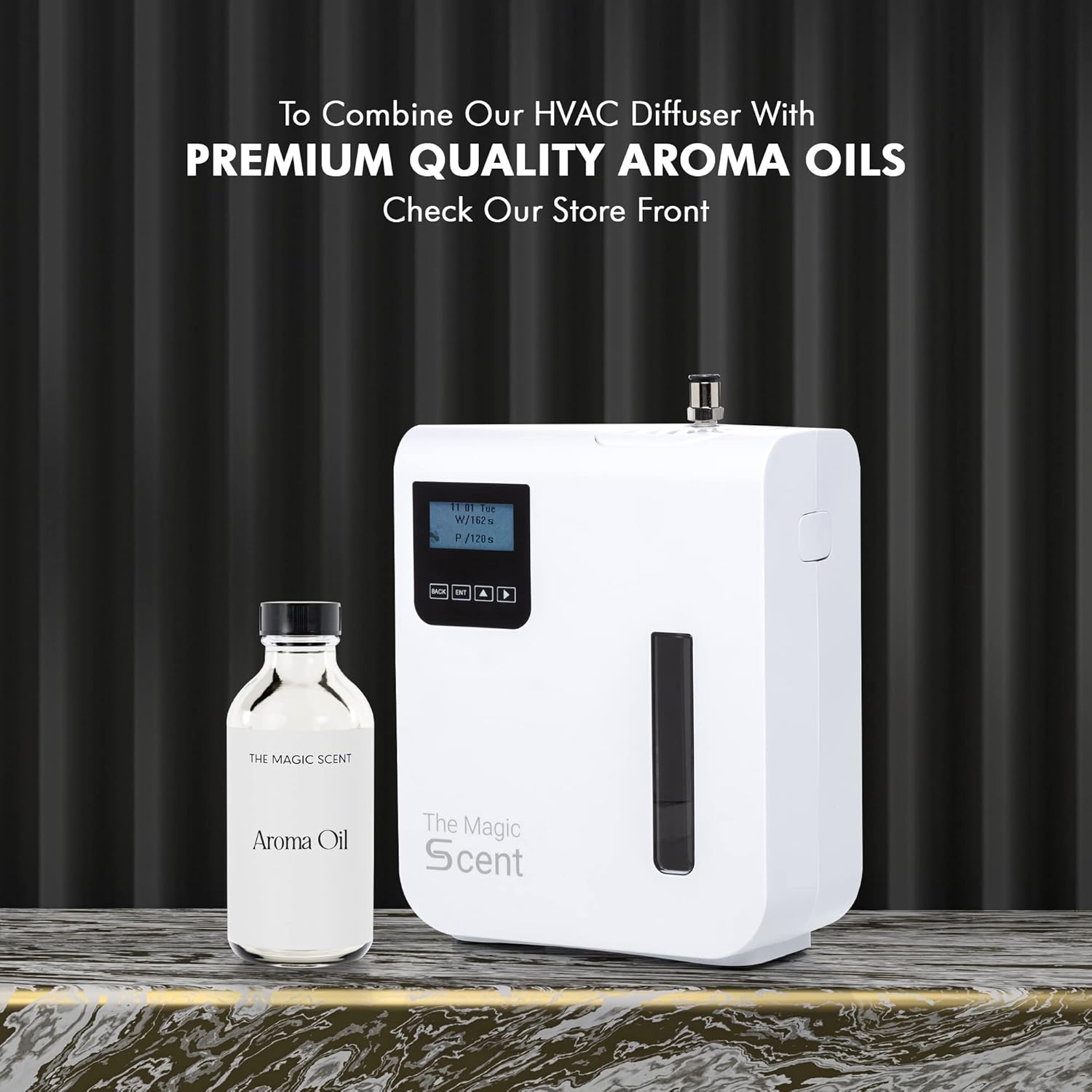 The diffuser next to a bottle of aroma oil