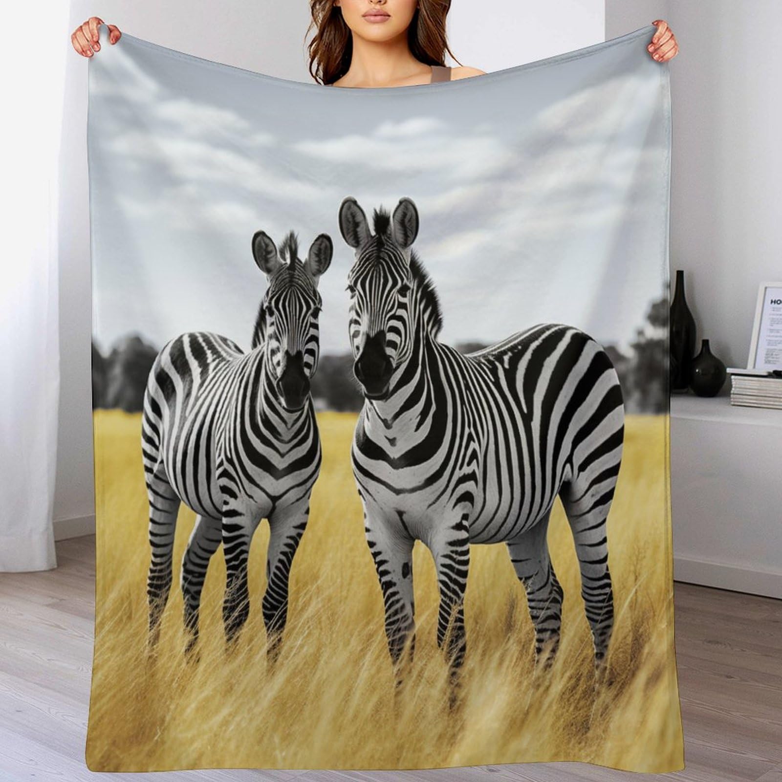 Couverture polaire zèbre et douce pour des soirées cocooning sur le sofa