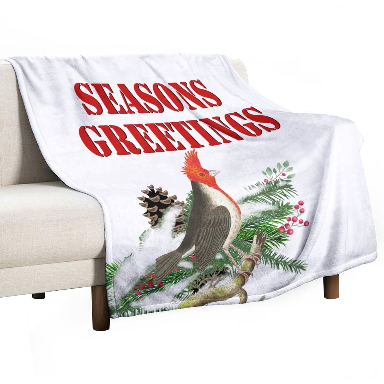 Couverture en flanelle oiseau rouge pour réchauffer vos soirées de Noël sur le canapé