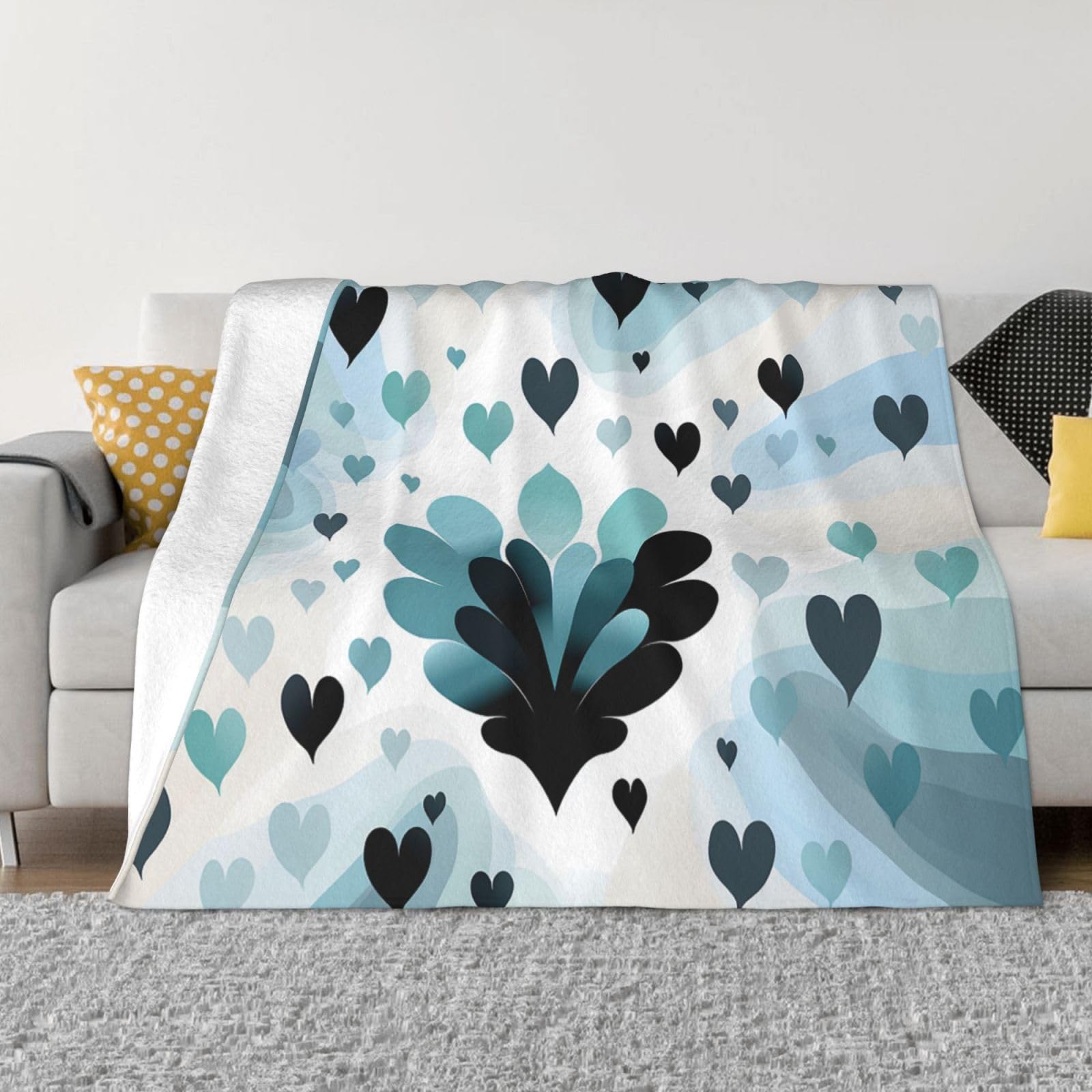 Couverture pour canapé motif cœur pour vos soirées cocooning