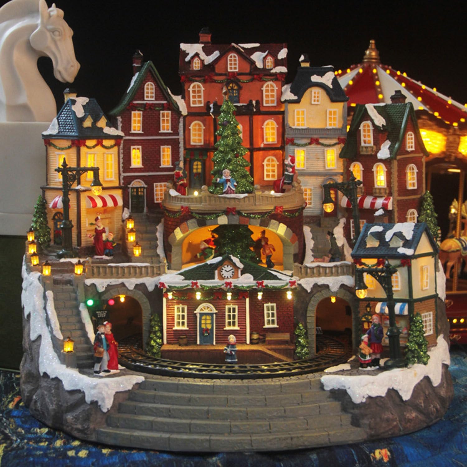 Christmas Village Houses Collectible Buildings, Moving Train Around The Village with Family with Warm Light Musical Christmas Ornaments for Christmas Holiday Decorations