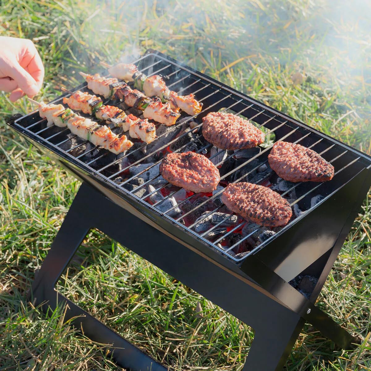 InnovaGoods® Faltbarer tragbarer Holzkohlegrill Foldyq, traditionelles und gesundes Kochen Ihrer Lebensmittel, aus Stahlmaterial, ideal für Zuhause und Garten.