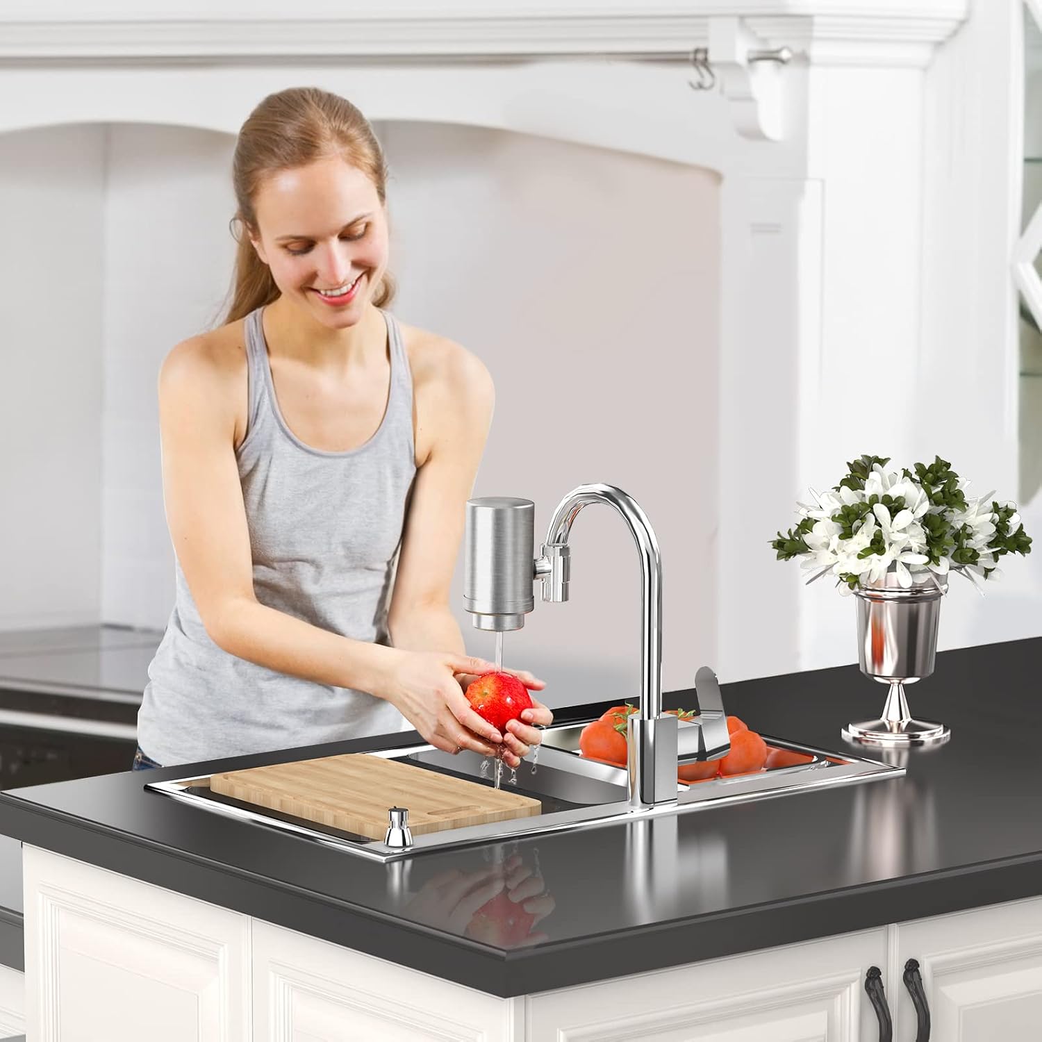 Woman washing an apple under a faucet with an OEMIRY water filter attached