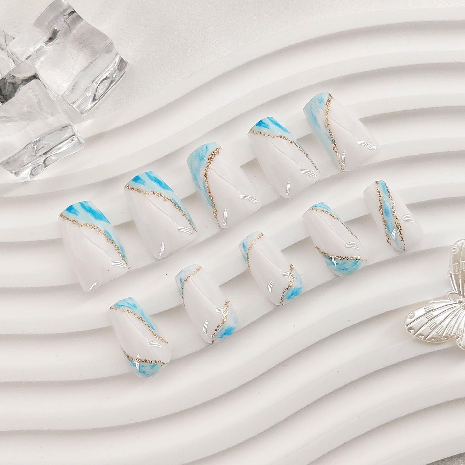 Summer Press on Nails Short Fake Nails with Blue Glitter Designs Coffin Nails Press ons French Tip Glue on Nails Nude Acrylic Nails Spring False Nails Natural Stick on Nails for Women 24Pcs