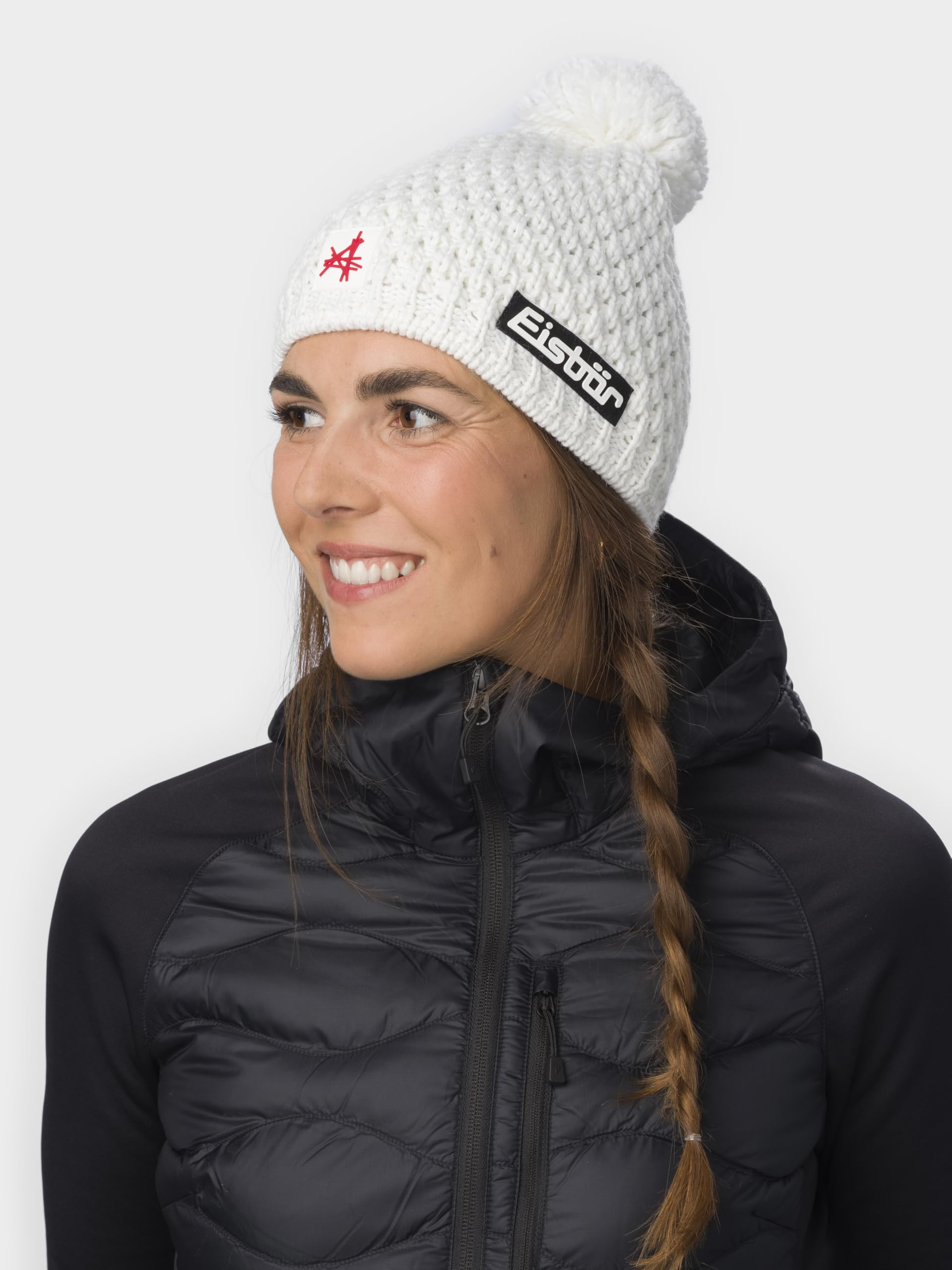Eisbär Czapka damska Trail Pompon Ski Austria – czapka zimowa z merynosów dla kobiet – z polarem chroni przed zimnem i wiatrem – oddychająca elastyczna czapka z dzianiny z Austrii