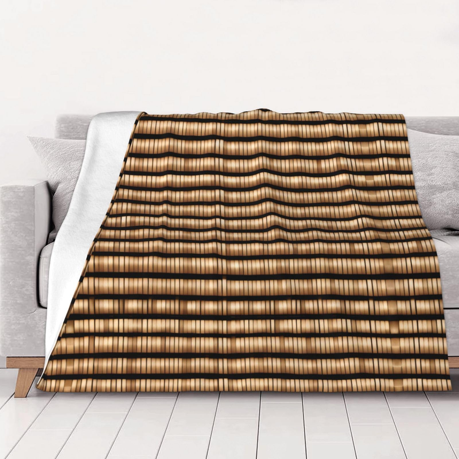 Couverture polaire motif osier pour cocooning sur le canapé du salon