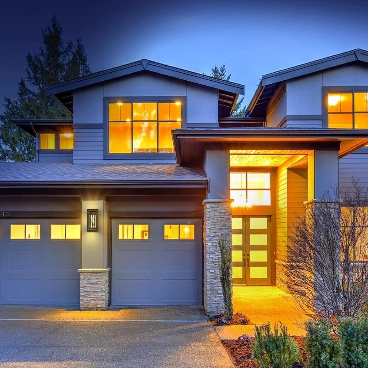 Feit Electric 14-inch Black Rectangular Lantern installed on a house at night