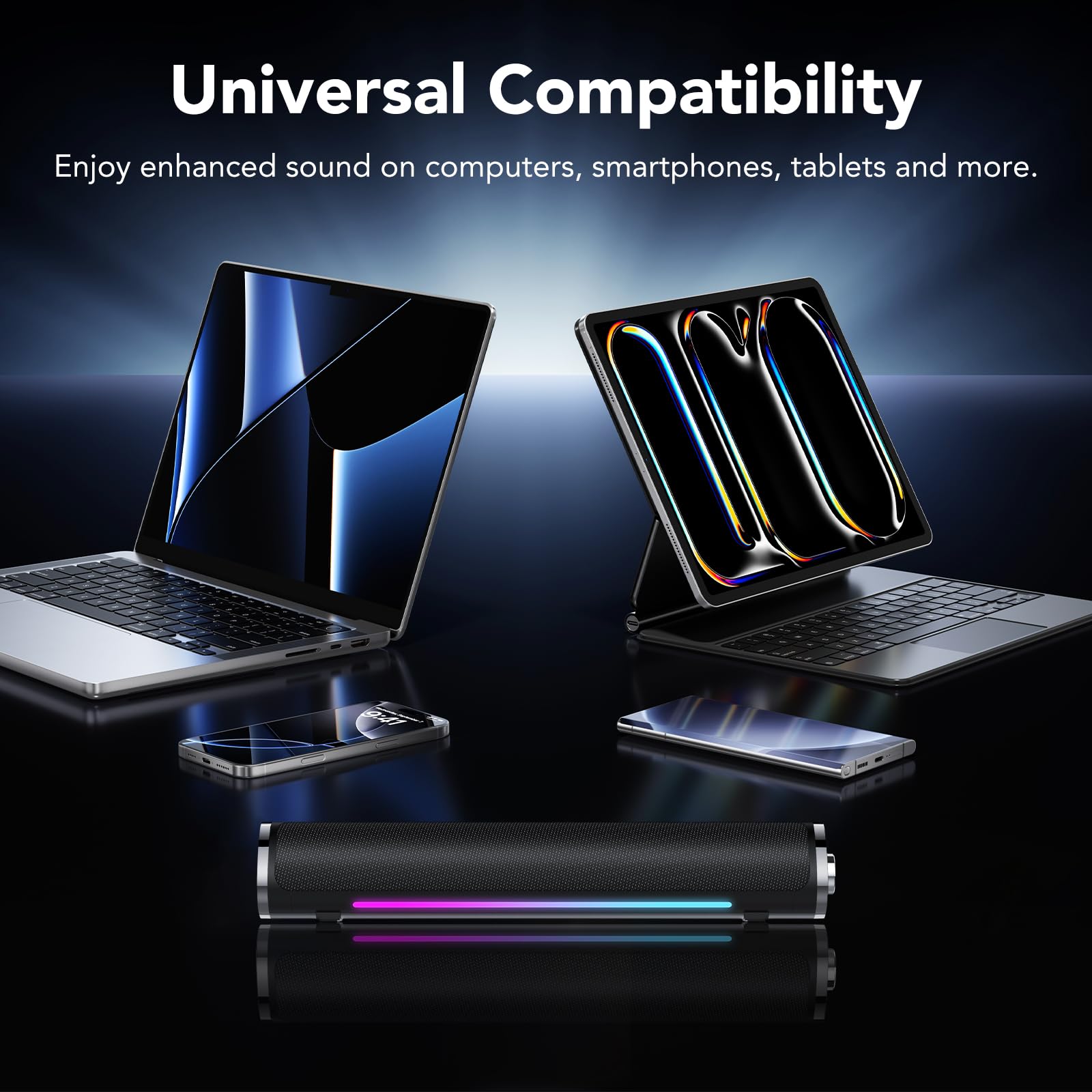 aowoka S24-1 speaker positioned between a laptop and a tablet, demonstrating universal compatibility