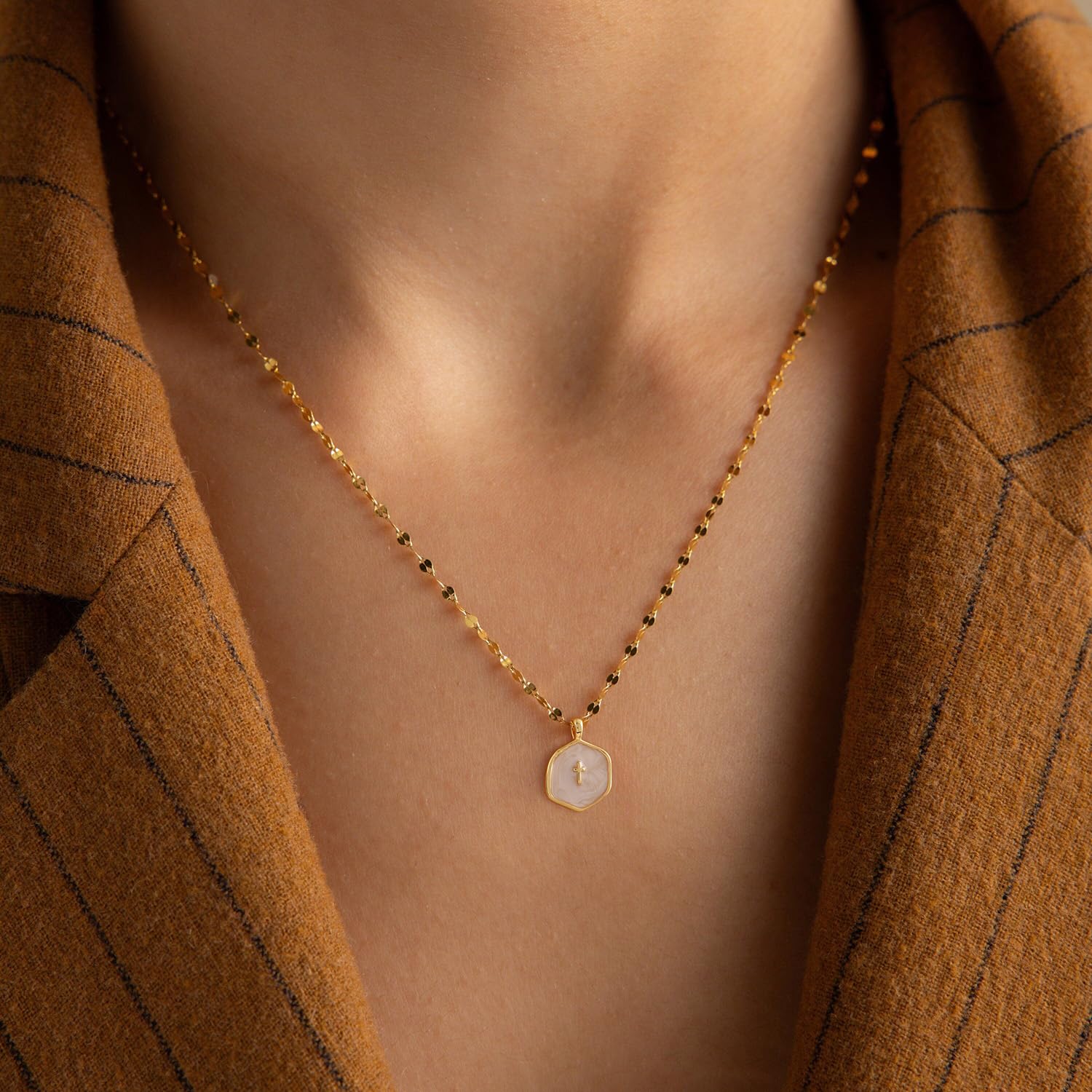 Close-up of the Patwes dainty 14K gold-plated cross pendant necklace, showcasing its minimalist design and adjustable chain.