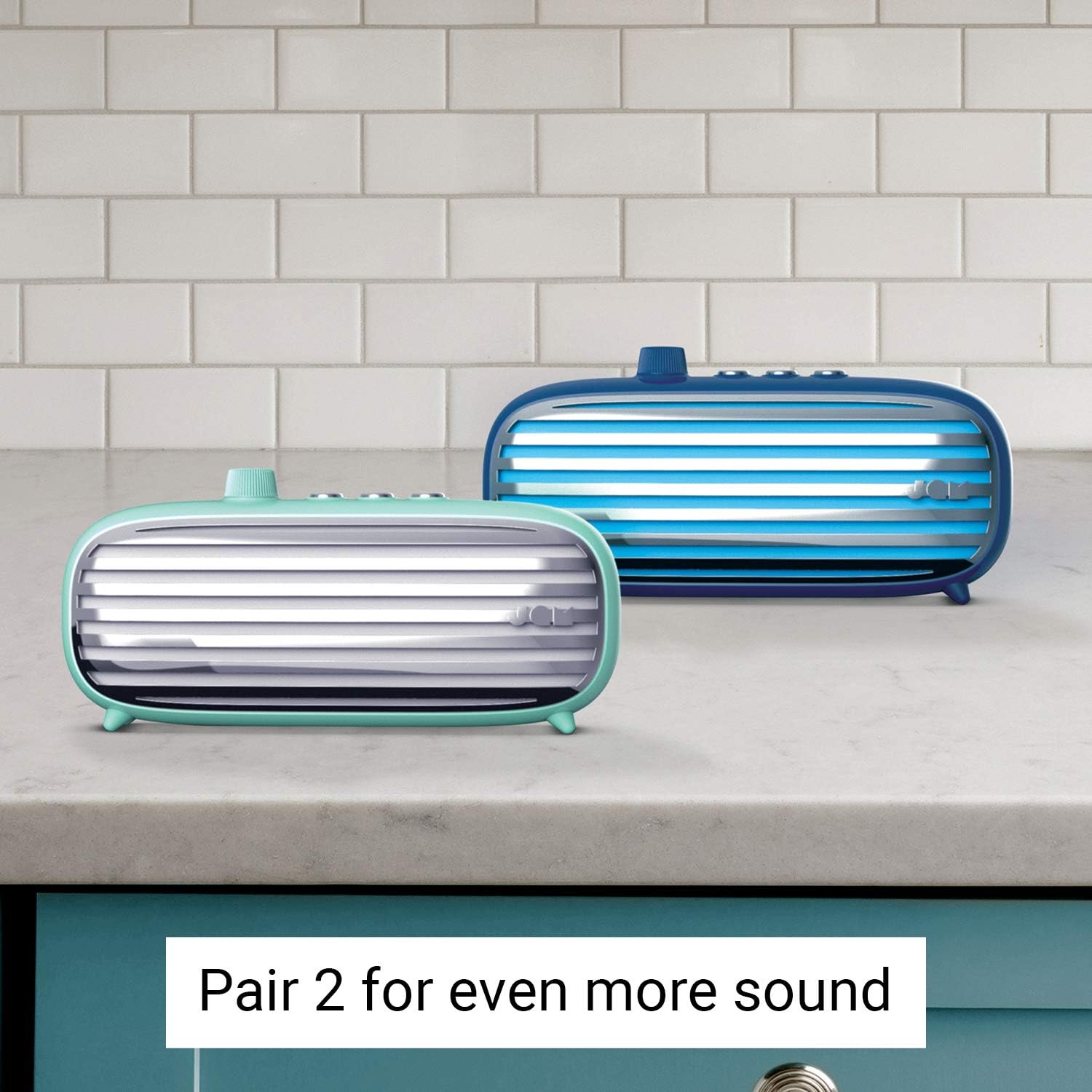 Two JAM Retro Classic+ Bluetooth Speakers, one blue and one mint, paired together on a counter.