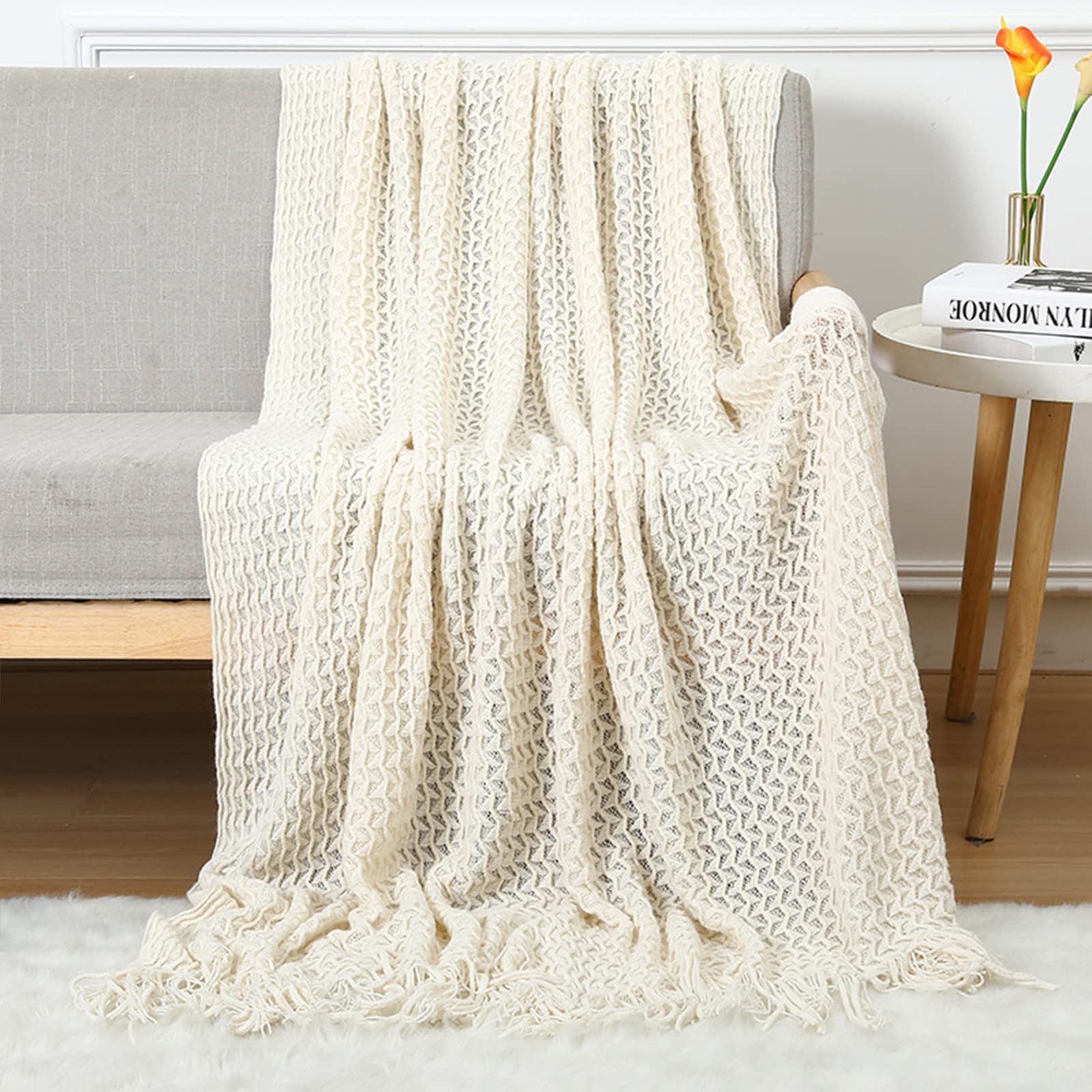 Couverture tricotée cellulaire LumiSyne à franges pour canapé et lit