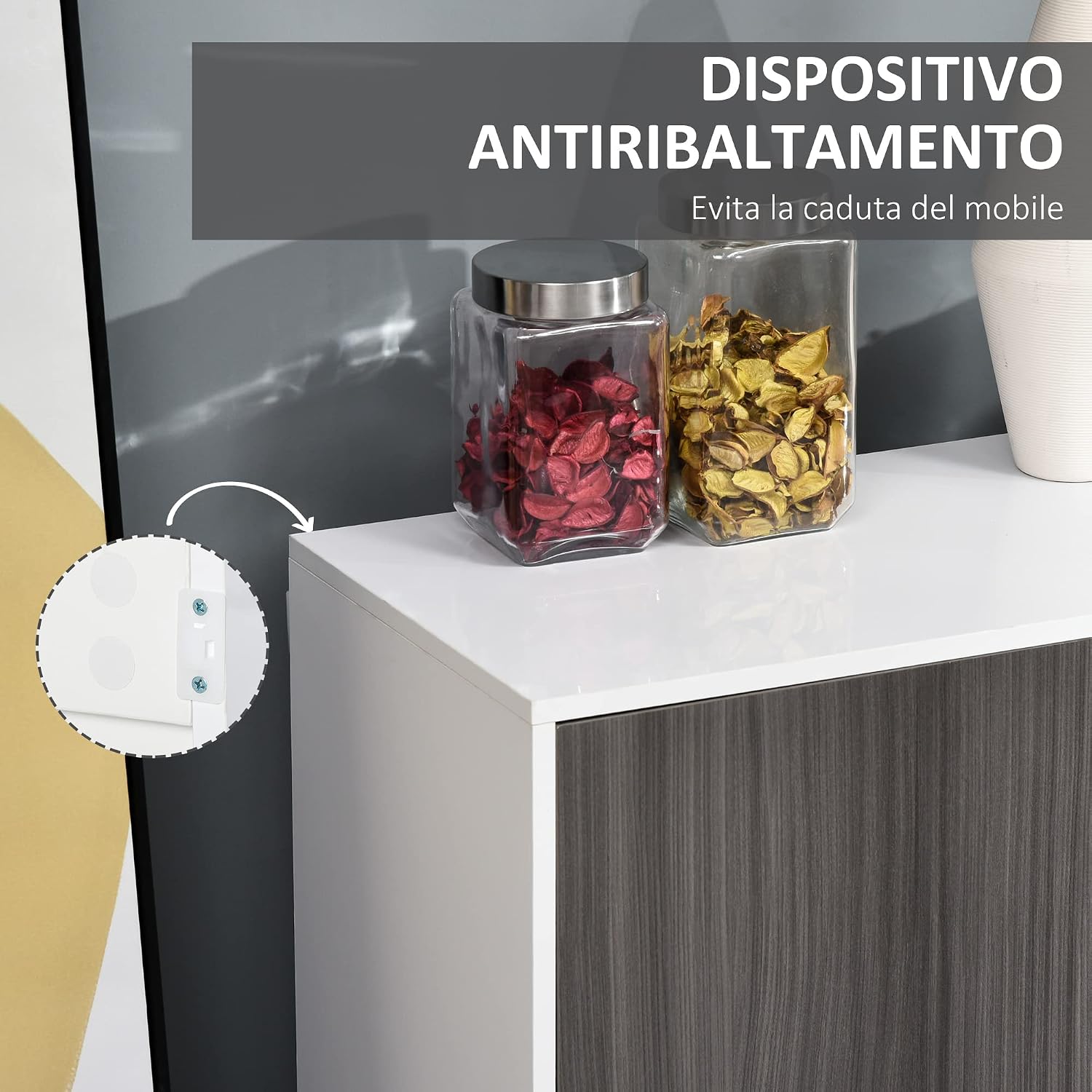 Close-up of the anti-tipping device installed on the back of the cabinet, with an arrow pointing to the wall attachment point.