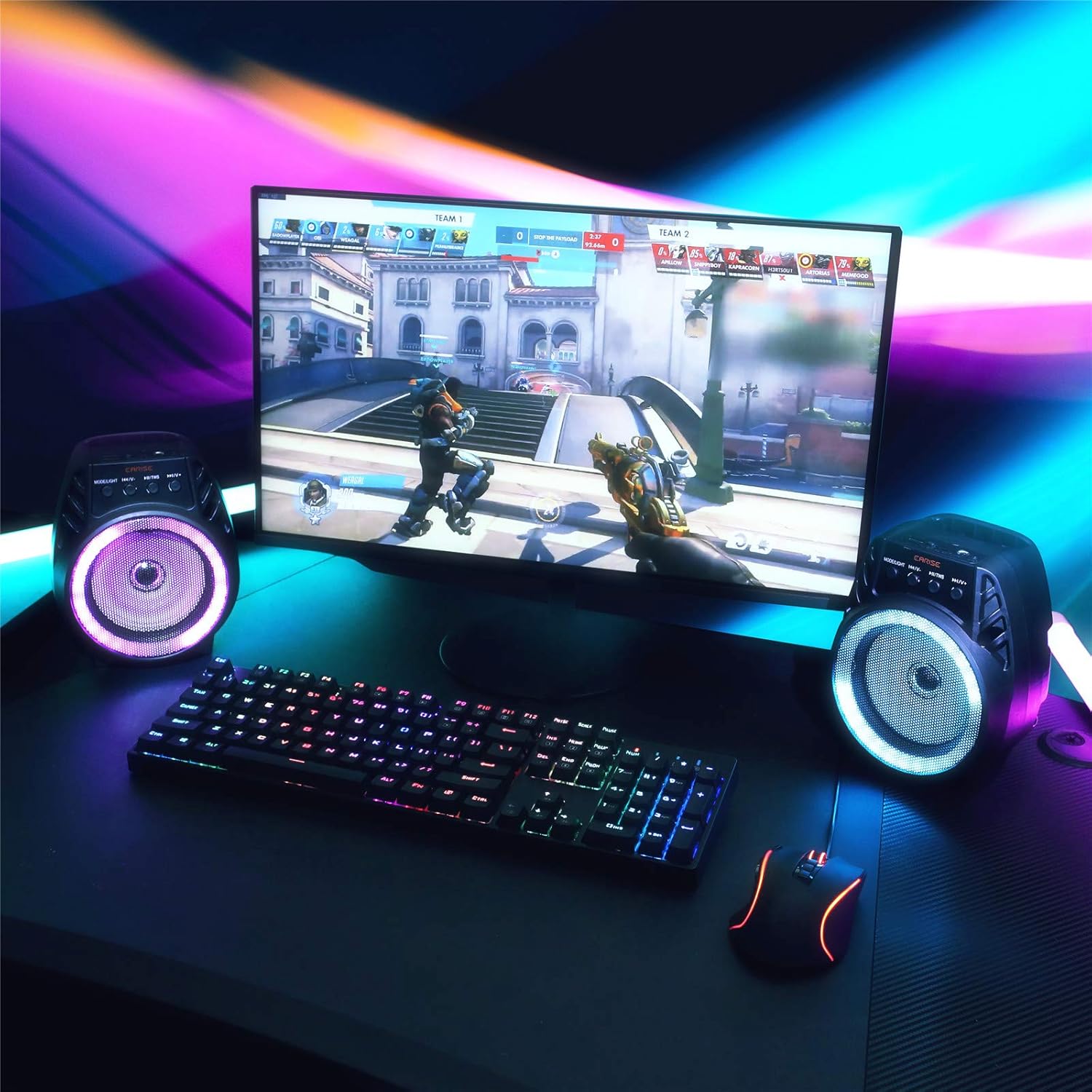 Two EARISE D51 speakers on a desk with a monitor, showcasing TWS wireless pairing