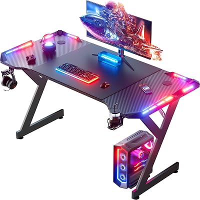 HLONONE LED Gaming Schreibtisch 120 x 60 cm, Gaming Tisch mit LED, Stabiler PC Tisch mit Kohlefaserbeschichtung, Gamer Tisch mit Getränkehalter und Kopfhörerhaken, Schwarz
