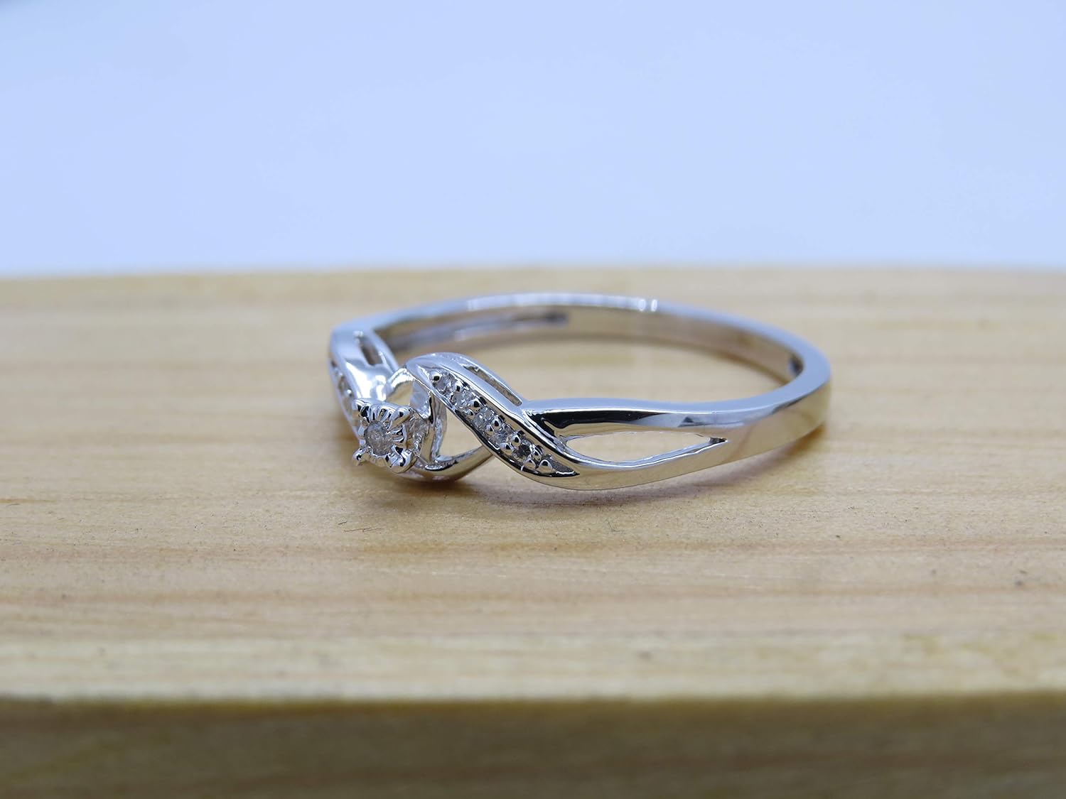 Dazzlingrock Collection Round White Diamond Crossover Swirl Promise Engagement Ring for Women (0.06 ctw, Color I-J, Clarity I2-I3) in 925 Sterling Silver