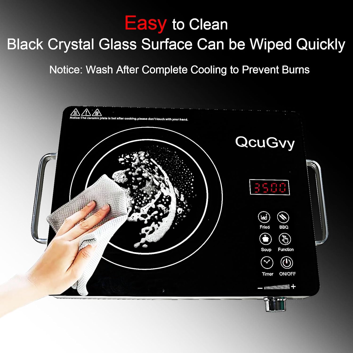 Hand wiping the black crystal glass surface of the QcuGvy burner, indicating it is easy to clean