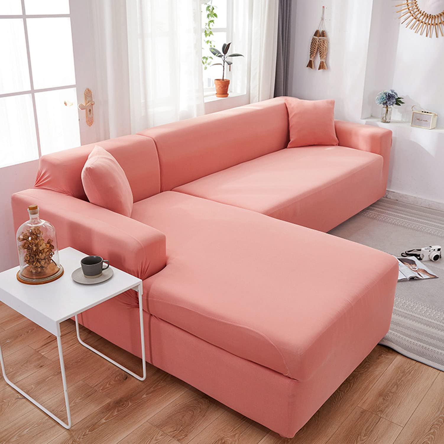 Housse de canapé extensible rose pour rénover un salon chaleureux en L