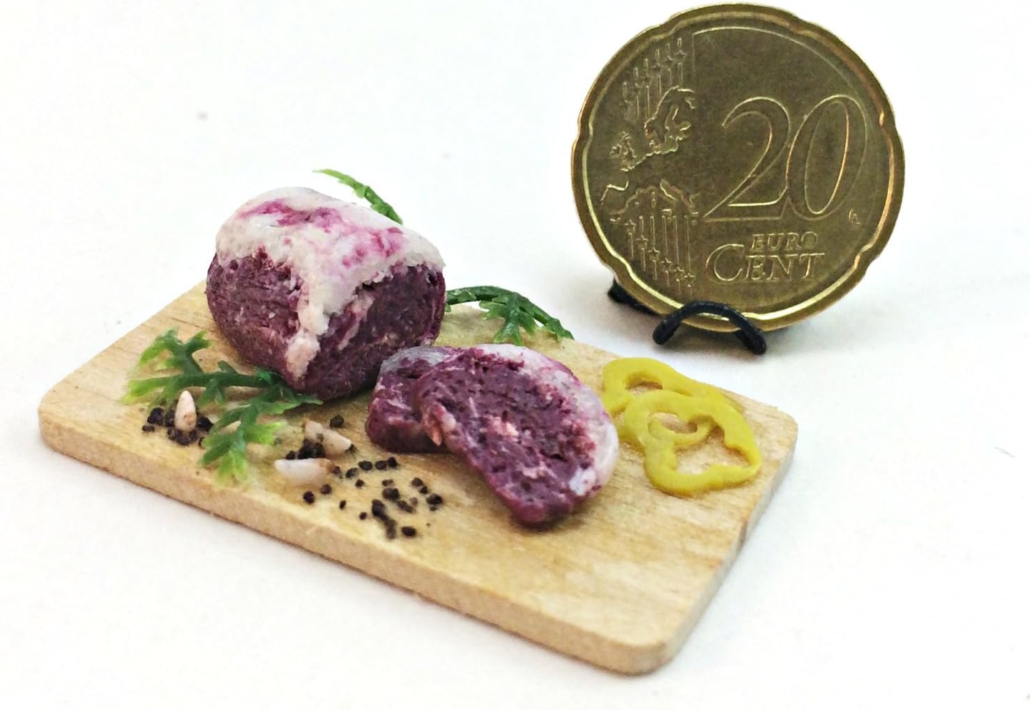 Fresh meat on the board, beef steak. Dollhouse miniature 1:12