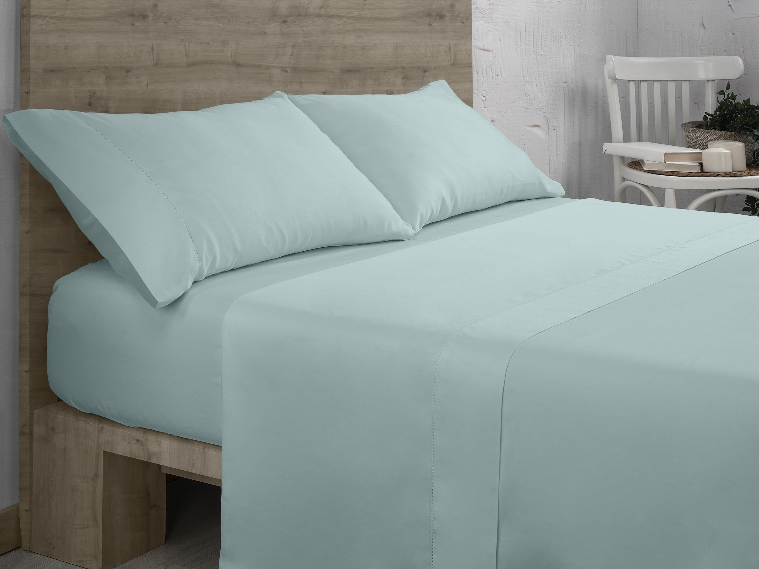 Sábana bajera ajustable de algodón orgánico color hielo. Cama de 90 cm.