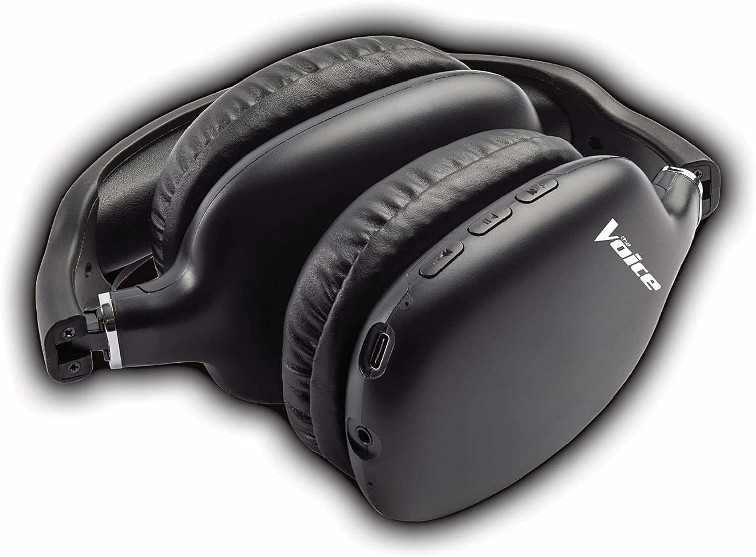 The Voice Hollywood Wireless Headphones placed next to a smartphone displaying a music streaming app, illustrating Bluetooth connectivity.