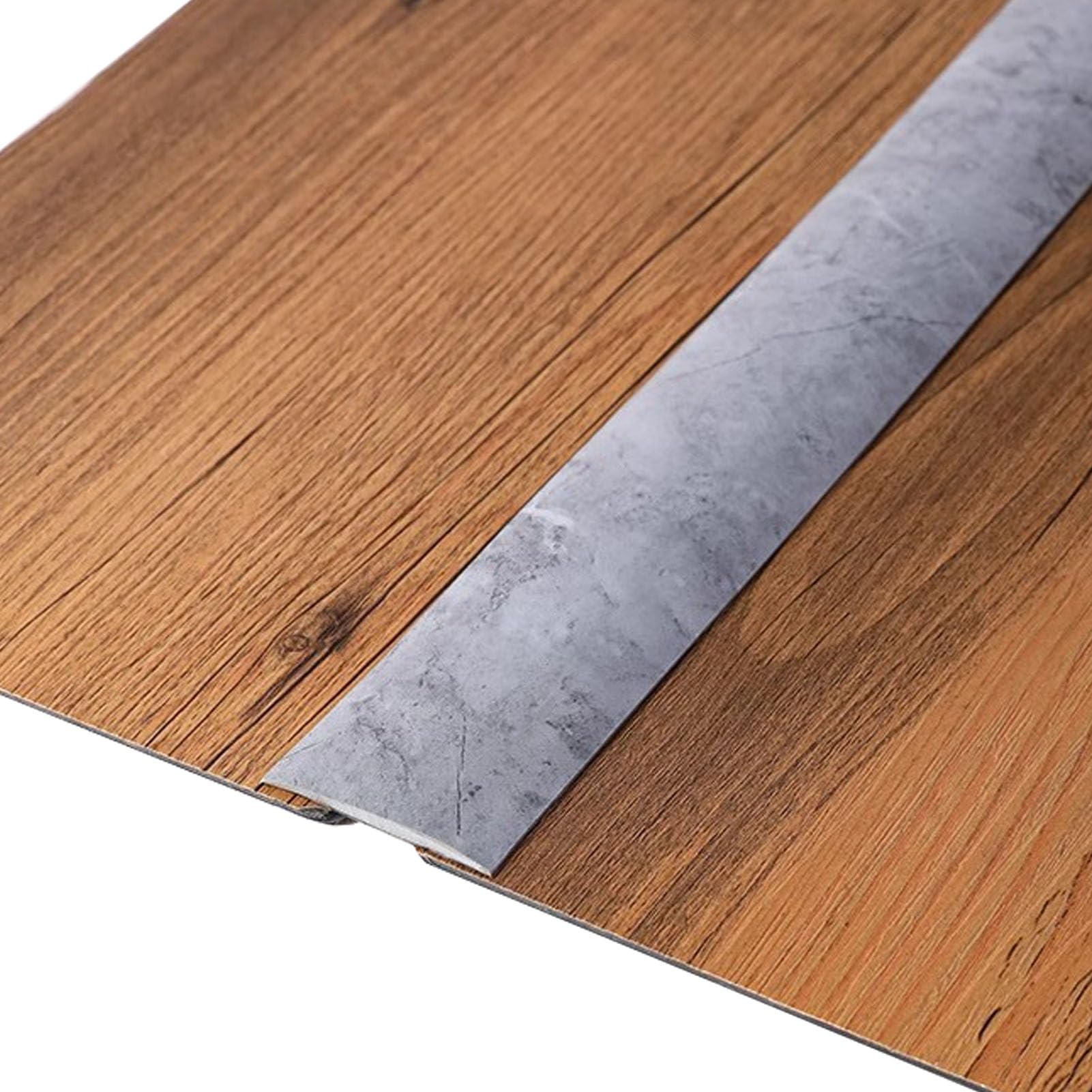 Bandes de seuil de porte en PVC gris pour masquer les joints de sol abîmés