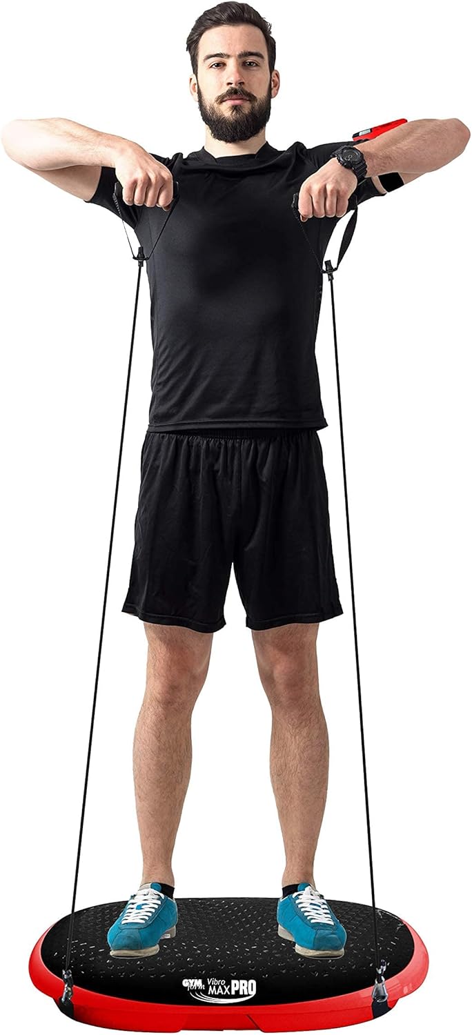 Man demonstrating exercise on Gymform Vibromax PRO with resistance bands, feet in a wide stance.