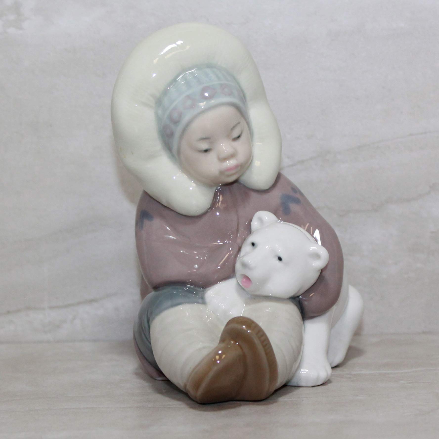 LLADRÓ Eskimo Playing. Porcelain Boy Figure