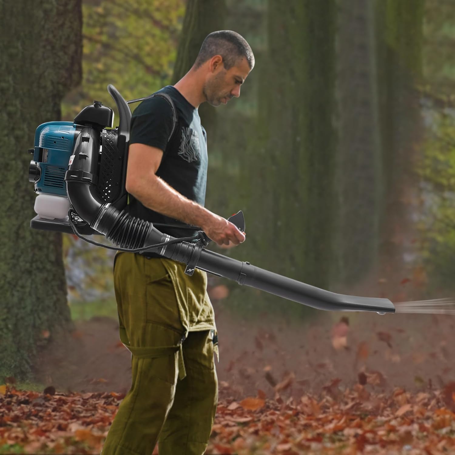 User operating the backpack leaf blower in a forest setting