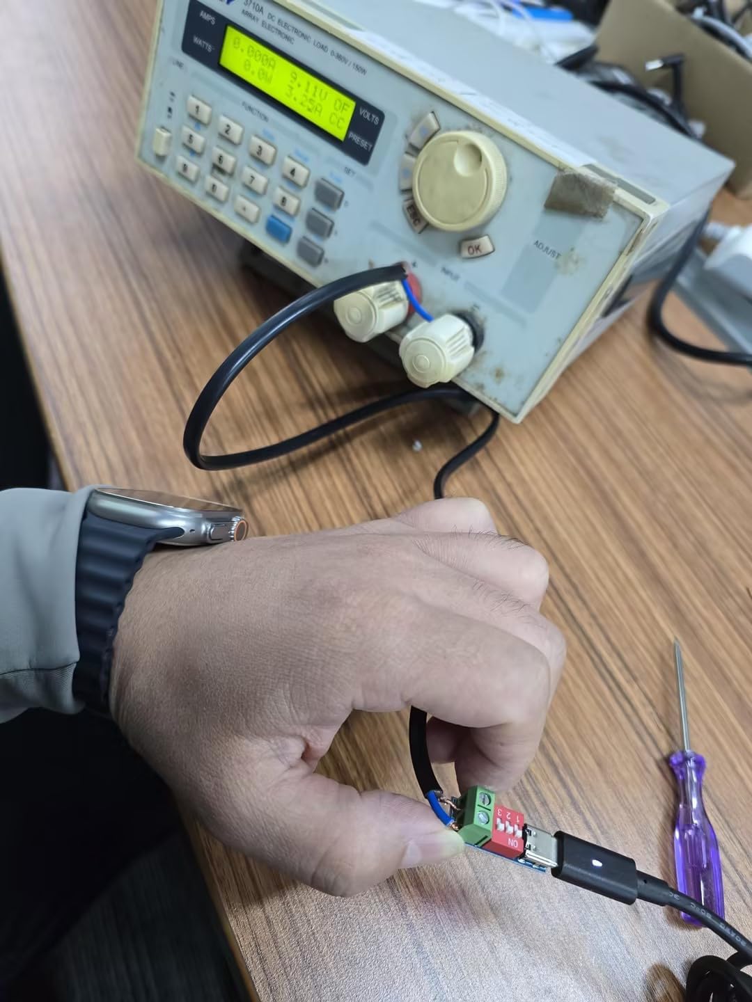 USB-C PD Trigger Board Module undergoing testing with measurement equipment.