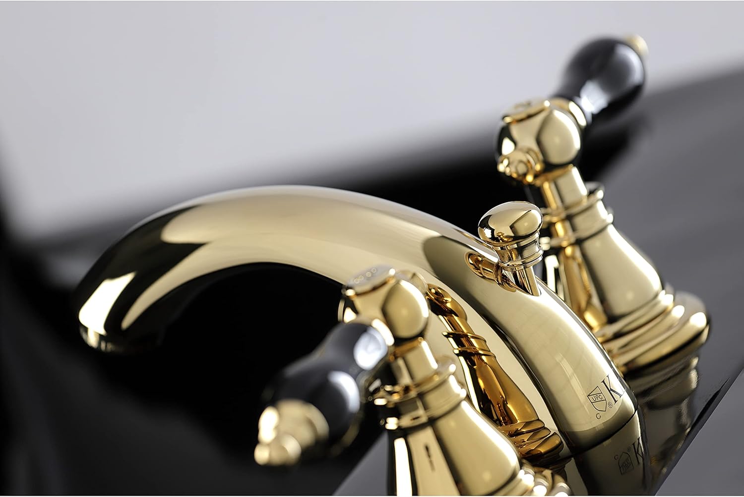 Kingston Brass KB952AKL Duchess Widespread Bathroom Faucet with Plastic Pop-Up, Polished Brass