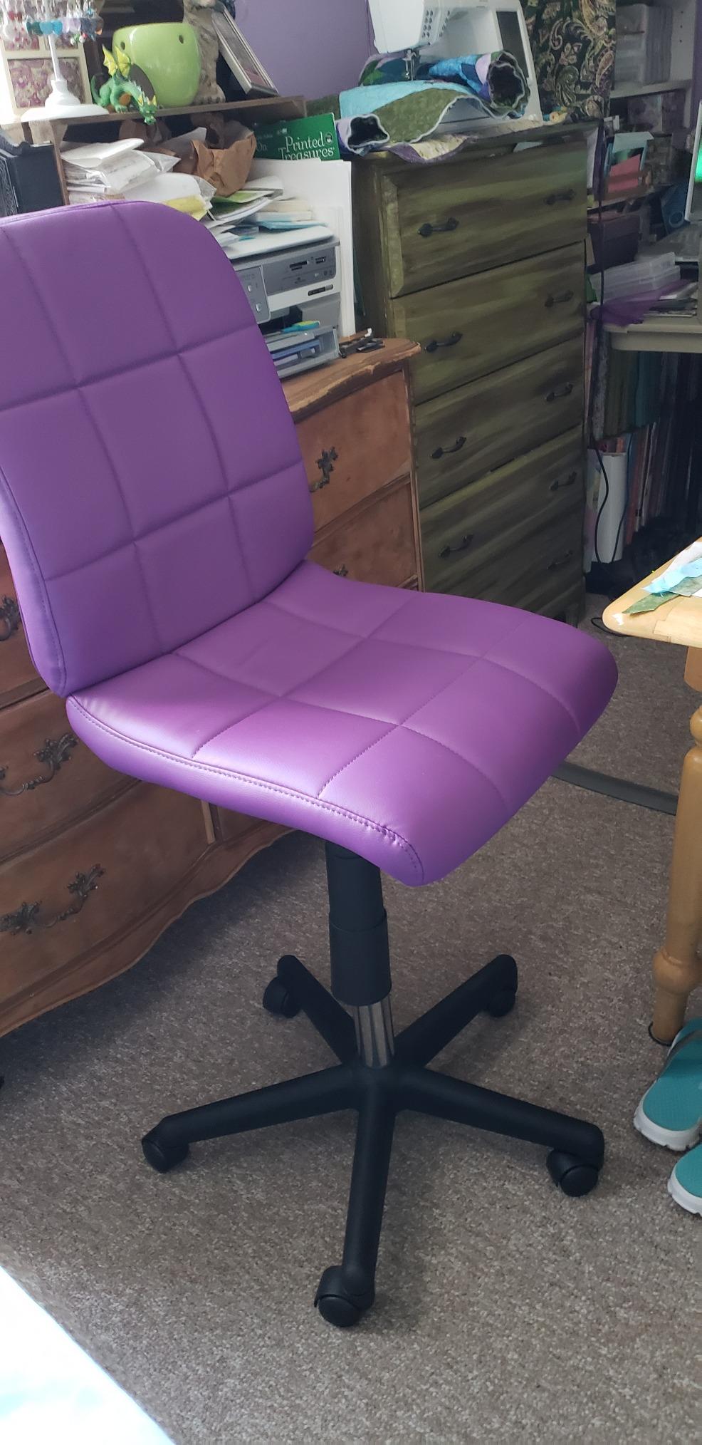 Turned purple office chair into higher drafting chair.