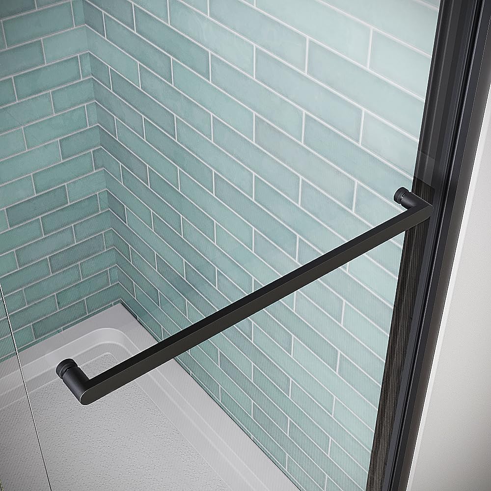 Close-up of the matte black stainless steel bar handle on the clear tempered glass shower door.