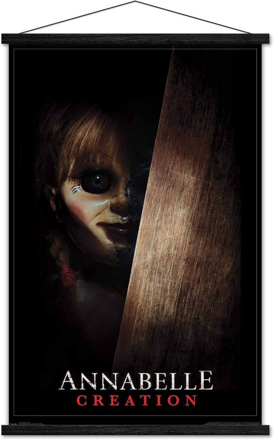 Trends International Annabelle - Peek Wall Poster, 22.375" x 34", Print and Black Hanger Bundle