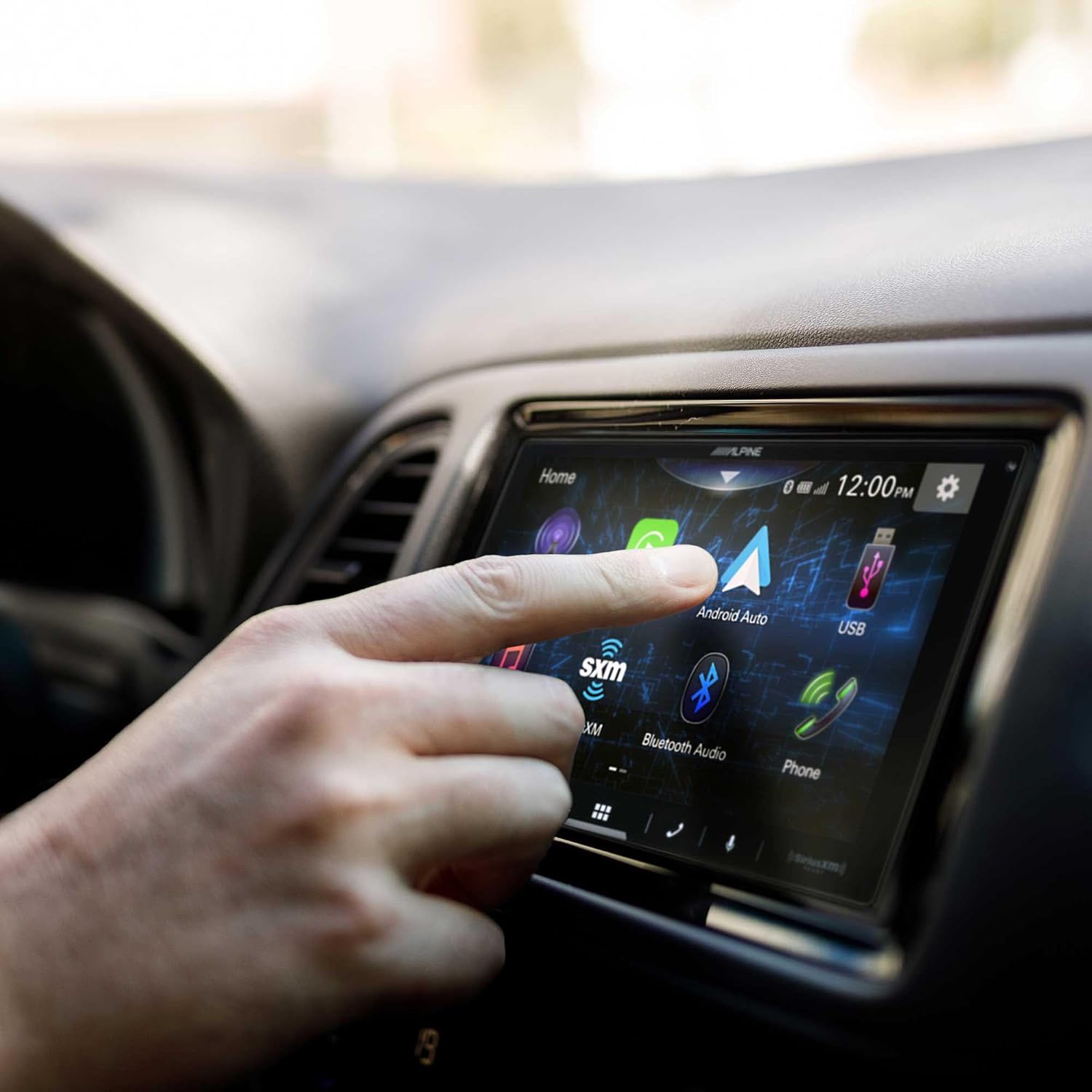 Hand selecting Android Auto on Alpine iLX-W670 screen