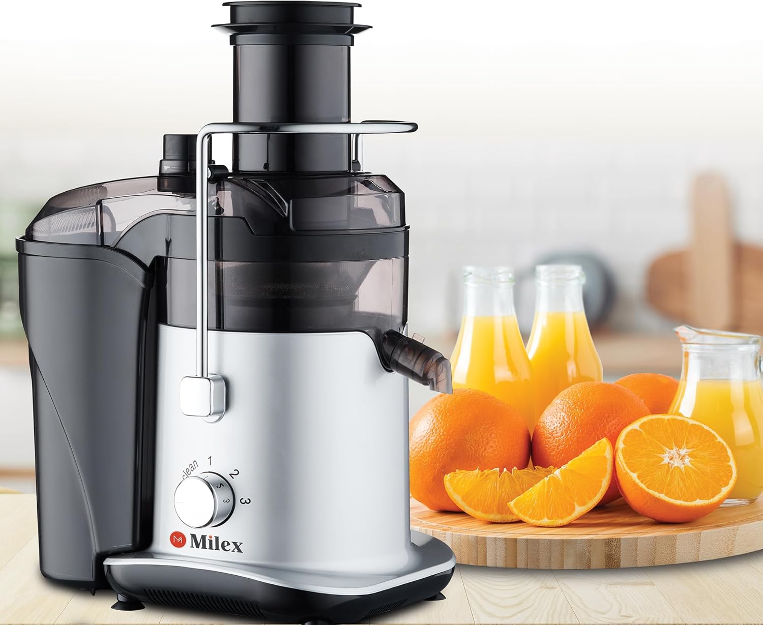 Milex MMJ002 Power Juicer assembled on a kitchen counter with oranges