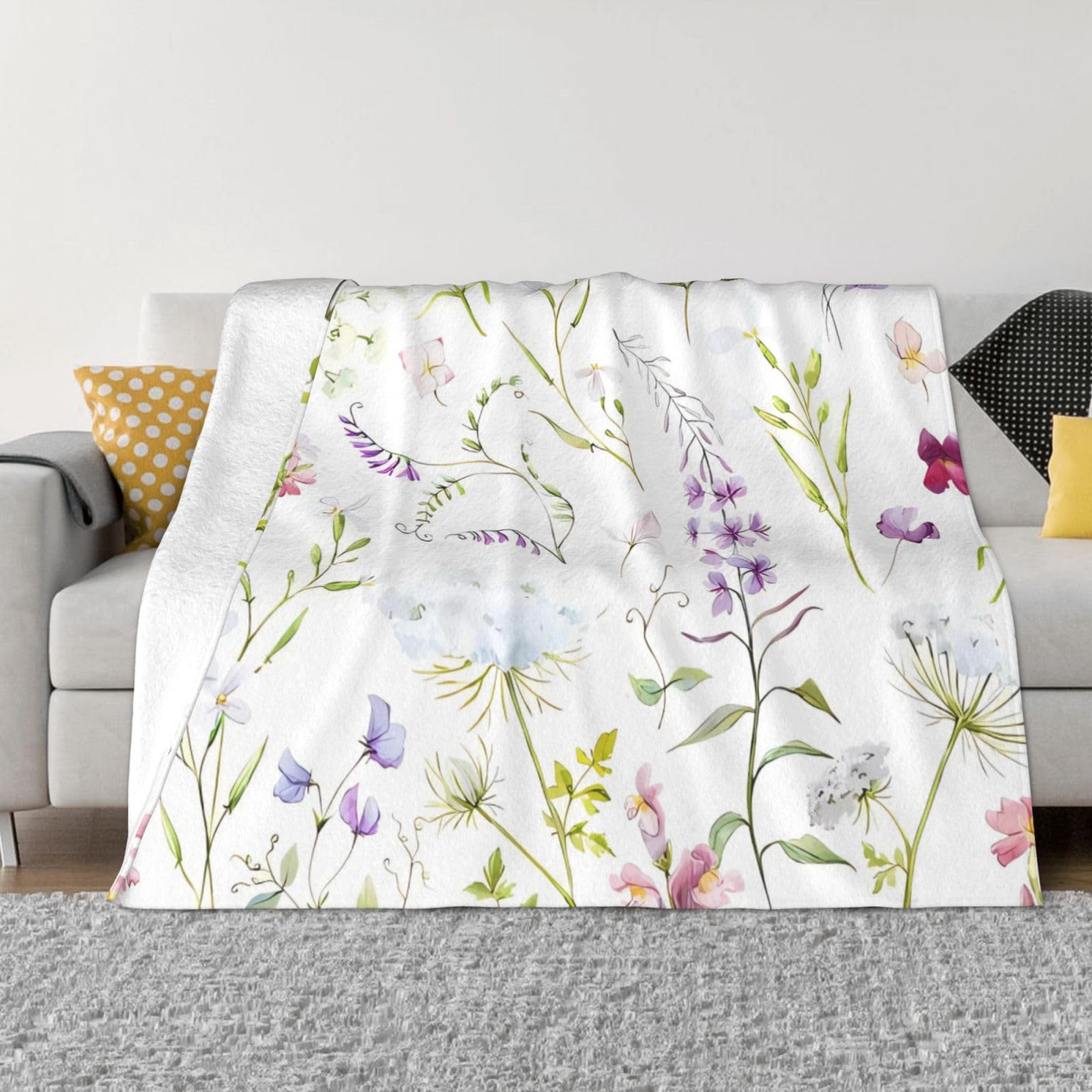 Couverture fleurie aquarelle KHiry pour un canapé chaleureux en hiver