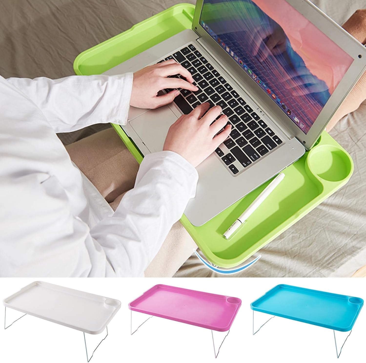 A person using a green ulafbwur folding laptop table with a laptop on it, showing the cup holder and device slot.