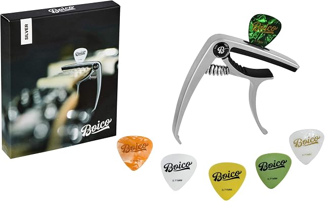 Capo For Acoustic Guitar Or Electric Guitar - Guitar Capo Is Fast Fret Changing Capo - Comes With 6 Guitar Picks - Has A Built In Pick Holder and a Bridge Pin Puller For Changing Safe The Strings